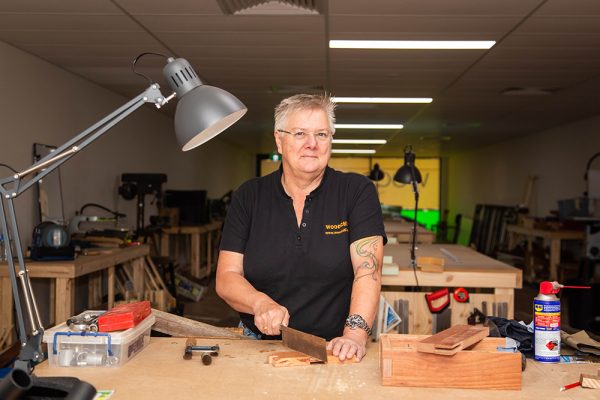 Picture of Gill at her woodworking bench